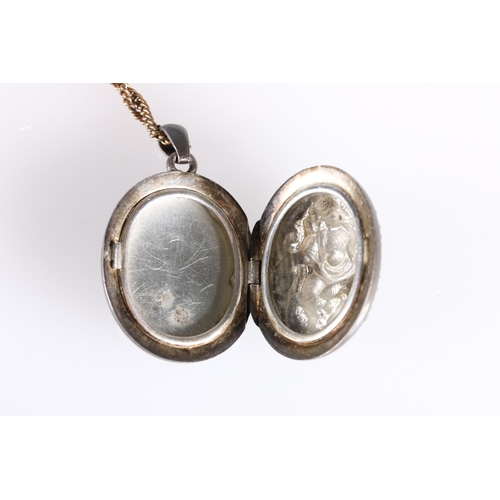 149 - Late 19th early 20th century white metal locket with deity entwined by serpent to front, 3.5cm. ... 