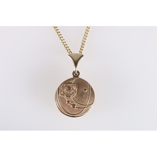 158 - 9ct gold photo locket with foliate design to one side, on 9ct gold chain, 16g gross. 