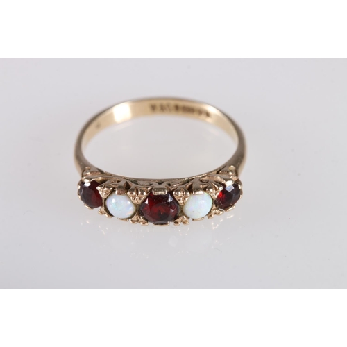 166 - Two 9ct gold rings, one with opals and garnets, size O, and another with clear and red/purple stones... 