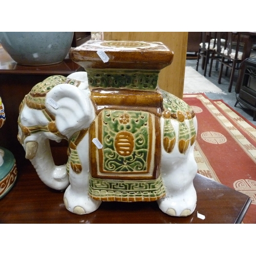 105 - Two elephant jardinière stands and a large blue pottery vase.