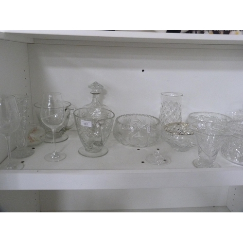 107 - Collection of cut and other glass including jugs, vases, bowls etc (one shelf).