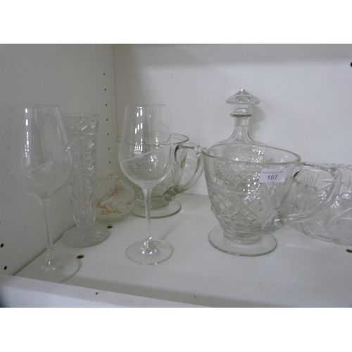 107 - Collection of cut and other glass including jugs, vases, bowls etc (one shelf).