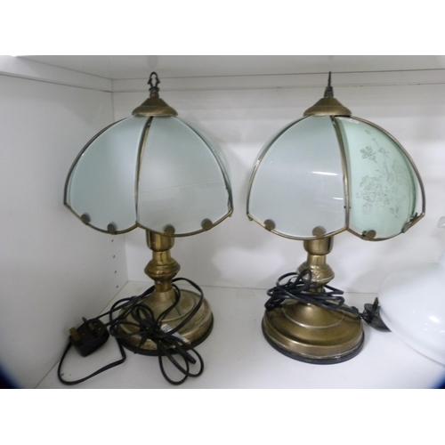 110 - Pair of table lamps and two others (one shelf).