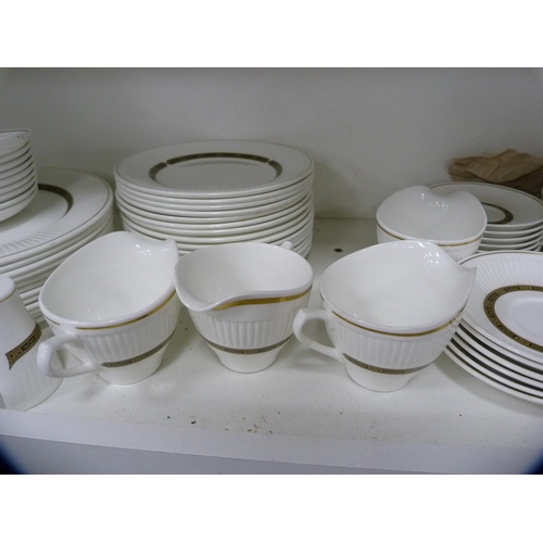 117 - Extensive Wedgwood 'Insignia' tea and breakfast set (two shelves).