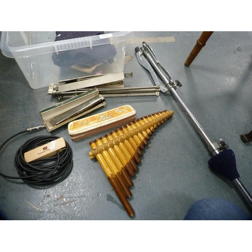 174 - Two music stands, harmonicas, pan pipes etc.