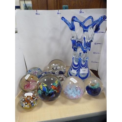 184 - Collection of various paperweights and a blue coloured vase.