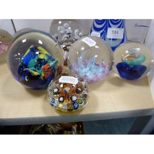 184 - Collection of various paperweights and a blue coloured vase.