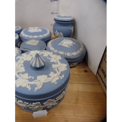 198 - Collection of Wedgwood blue Jasper ware to include trinket boxes and covers, spill vases etc.