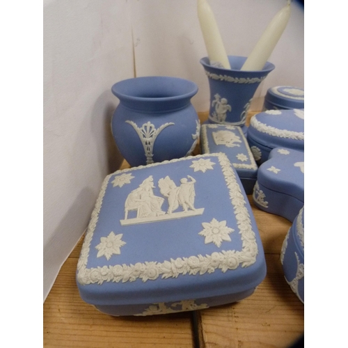 198 - Collection of Wedgwood blue Jasper ware to include trinket boxes and covers, spill vases etc.