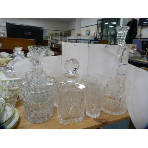 202 - Crystal and glassware to include three assorted decanters, vases and tumblers.  (13)