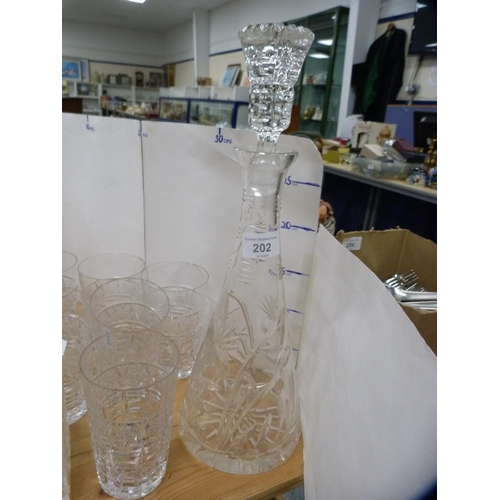 202 - Crystal and glassware to include three assorted decanters, vases and tumblers.  (13)