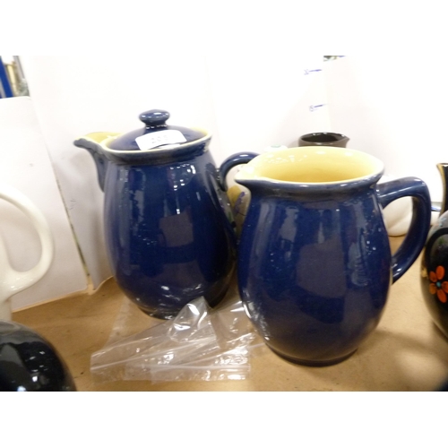 205 - Collection of assorted glazed teapots and jugs to include a Denby blue glazed jug etc.