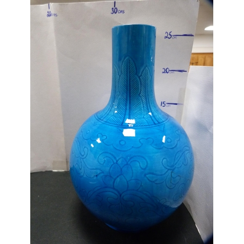 230 - Burmantoft-style blue glazed vase with floral and scroll decoration.