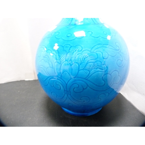 230 - Burmantoft-style blue glazed vase with floral and scroll decoration.