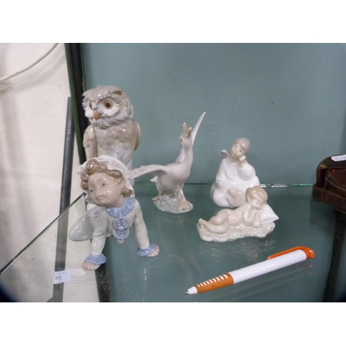 243 - Nao figure of an owl, three Lladro figures and another Spanish figure of an angel.  (5)