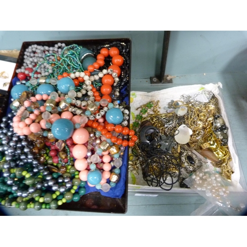 245 - Two trays of costume jewellery to include bead necklaces, pendants etc.