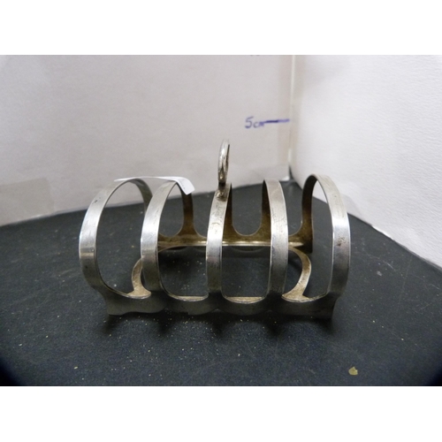 249 - Silver four-bar toast rack, hallmarks for Sheffield, 59g gross.