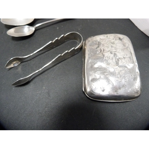 251 - Small silver cigarette case and a napkin ring, 74g gross, silver spoons, silver sugar nips, plated s... 