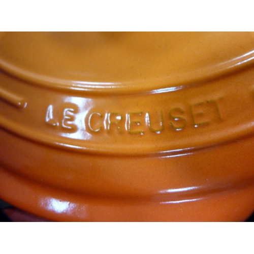 34 - Three Le Creuset casseroles.