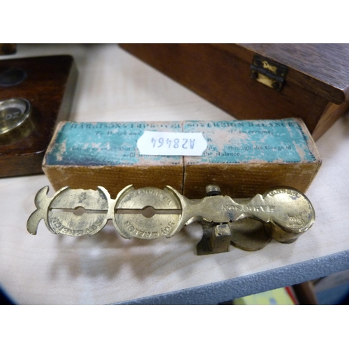 35 - Two sets of postal scales and a pair of wooden bookends.