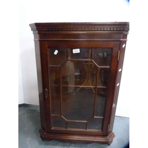 375 - Reproduction corner wall cabinet and a magazine table.  (2)