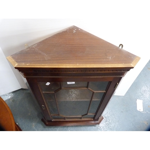 375 - Reproduction corner wall cabinet and a magazine table.  (2)