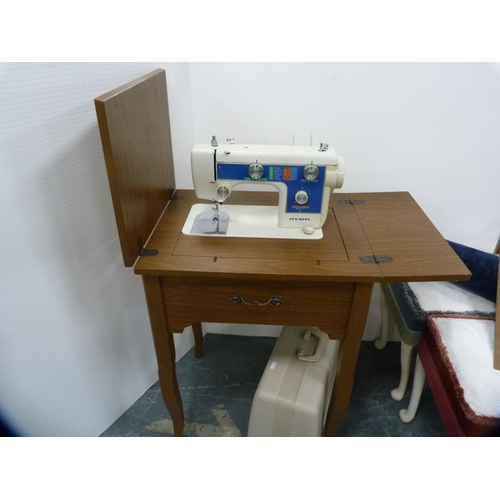 378 - New Home table sewing machine with case.