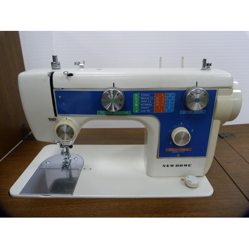 378 - New Home table sewing machine with case.