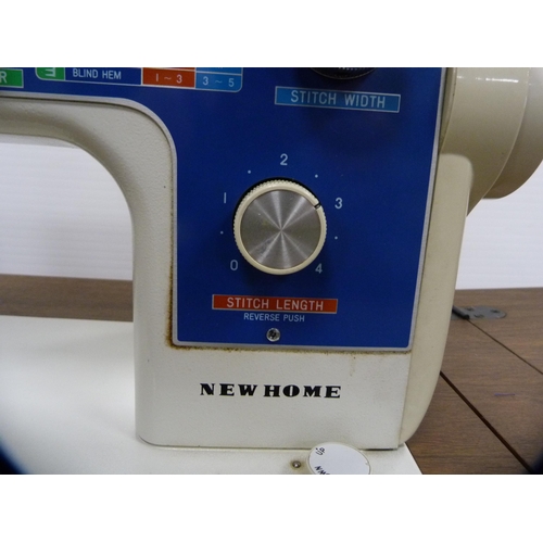 378 - New Home table sewing machine with case.