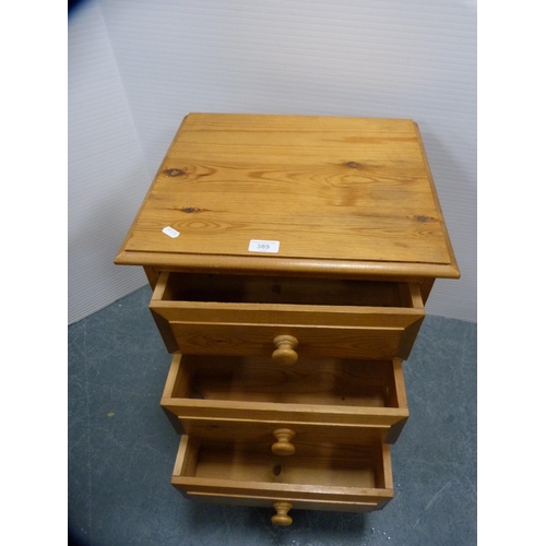 385 - Pine three-drawer bedside chest of drawers.