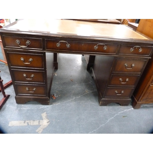 390 - Reproduction mahogany kneehole desk with tooled leather skiver.