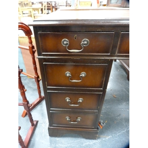 390 - Reproduction mahogany kneehole desk with tooled leather skiver.