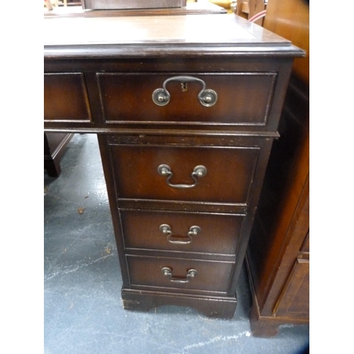 390 - Reproduction mahogany kneehole desk with tooled leather skiver.