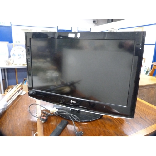 394 - LG television and a small Altius television, both with remote controls.  (2) BOTH RETURNED - NOT WOR... 