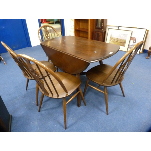 406 - Ercol drop-leaf dining table and a set of four wheel-back spindle chairs.  (5)