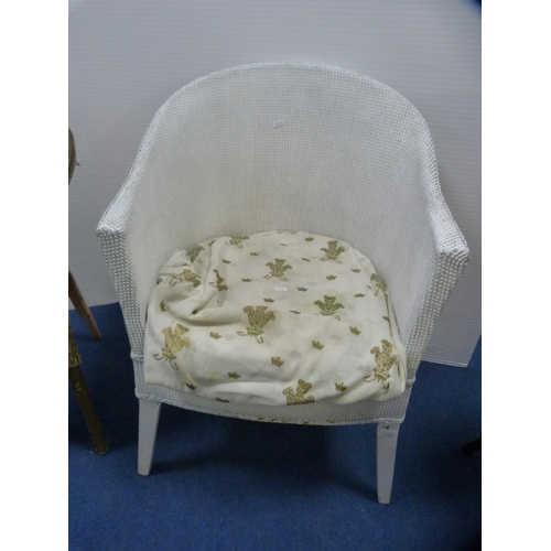 414 - Two woven fibre tub chairs and a modern oval occasional table.  (3)