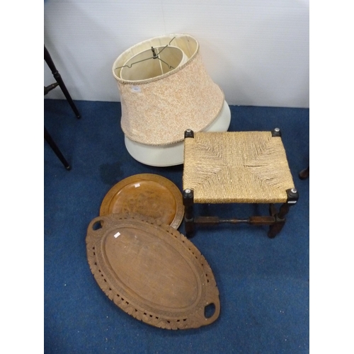 421 - Oak-framed stool, two wooden trays and a quantity of lampshades.