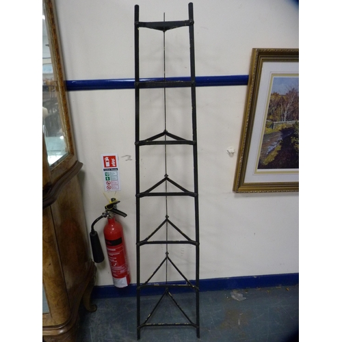 436 - Triangular metal stand.