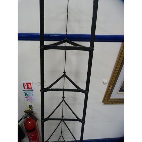 436 - Triangular metal stand.