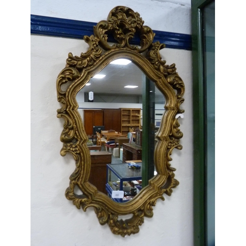 66 - Ornate gilt framed mirror.