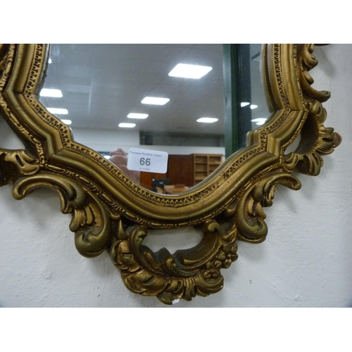 66 - Ornate gilt framed mirror.