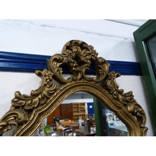 66 - Ornate gilt framed mirror.