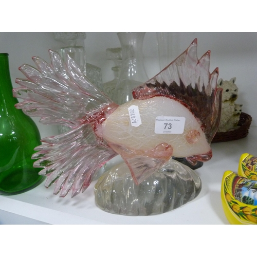 73 - Mdina-style coloured glass fish, decanters, pair of continental figures, pair of clogs etc (one shel... 