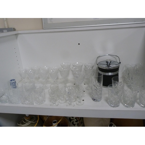 79 - Collection of various cut and other glassware and an ice bucket etc (one shelf).