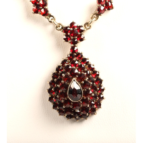 103 - Ladies Victorian garnet necklace, central teardrop garnet surrounded by a cluster of garnets in tear... 