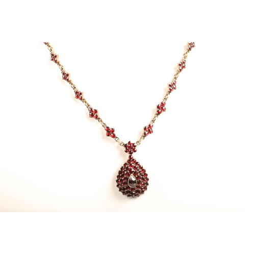 103 - Ladies Victorian garnet necklace, central teardrop garnet surrounded by a cluster of garnets in tear... 