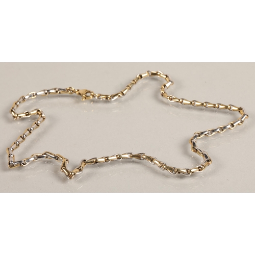 89 - 9ct white and yellow gold chain, 24.5g