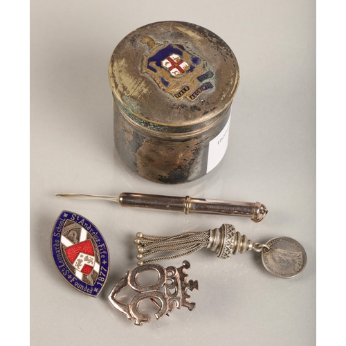 99 - Plated silver tin with Melbourne coat of arms atop, assorted pin badges and fobs some silver