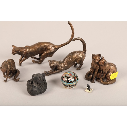 181 - Four bronze cat figures, black fish netsuke, and miniature cloisonne apple