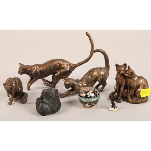 181 - Four bronze cat figures, black fish netsuke, and miniature cloisonne apple